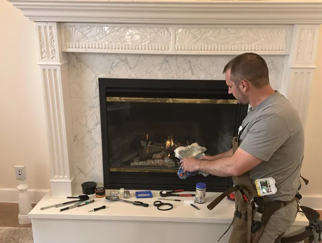 Pineville Chimney Sweep performing fireplace maintenance in Pineville, NC