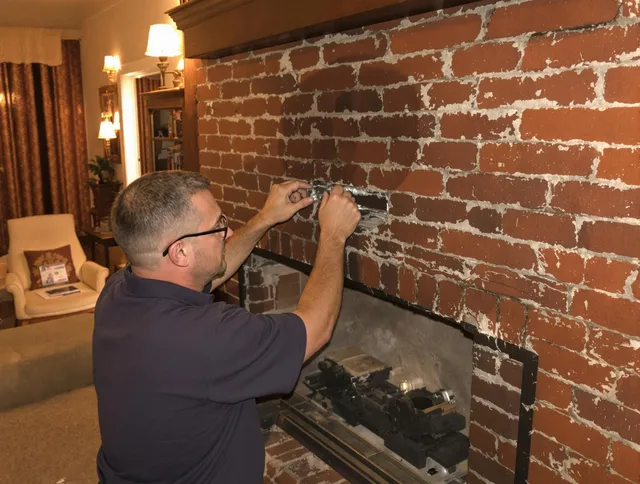 Pineville Chimney Sweep expert fixing a fireplace in Pineville, NC